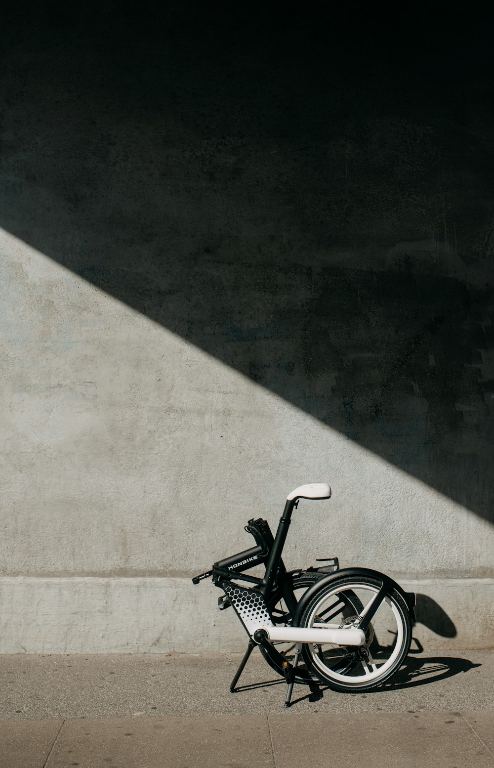 a bicycle parked on a sidewalk