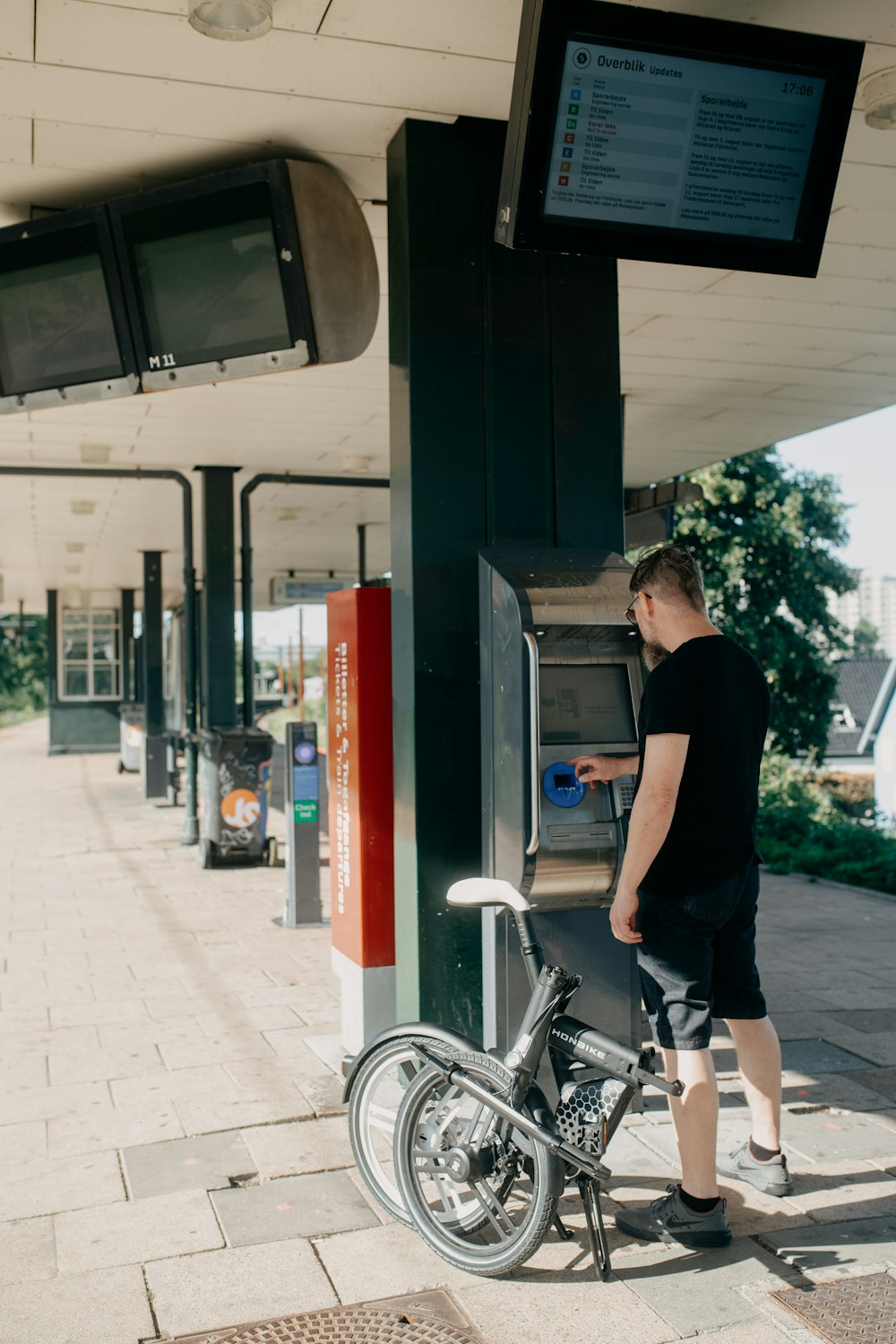 a person standing next to a bike