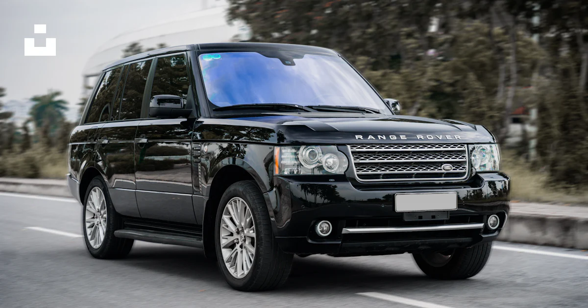 A black suv driving on a road photo – Free Car Image on Unsplash