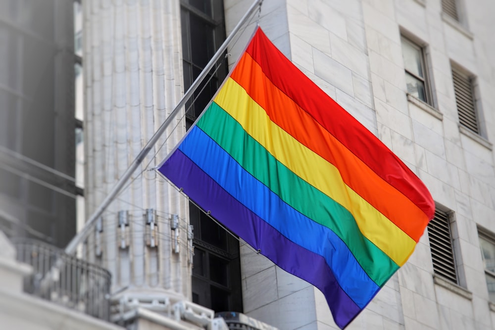 a flag flying in front of a building