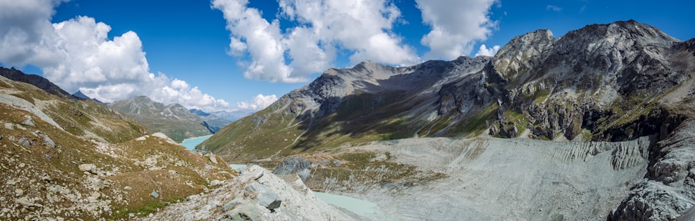 a river running through a valley between mountains