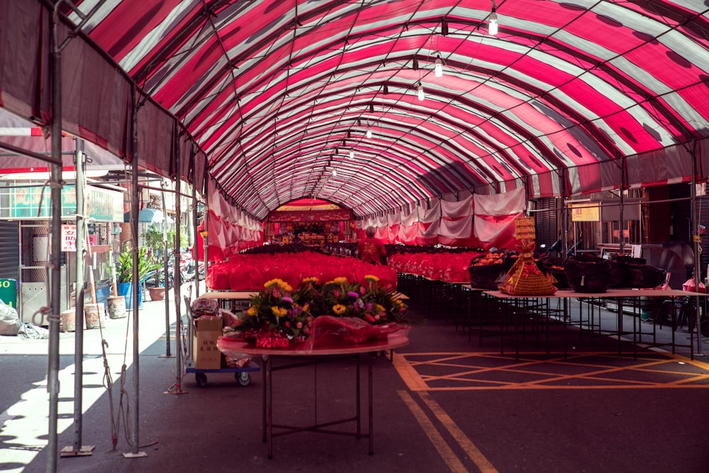 a large red tent with flowers