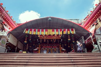 a large red building with a large staircase