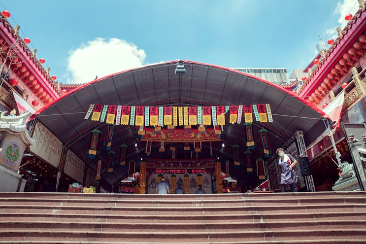 a large red building with a large staircase