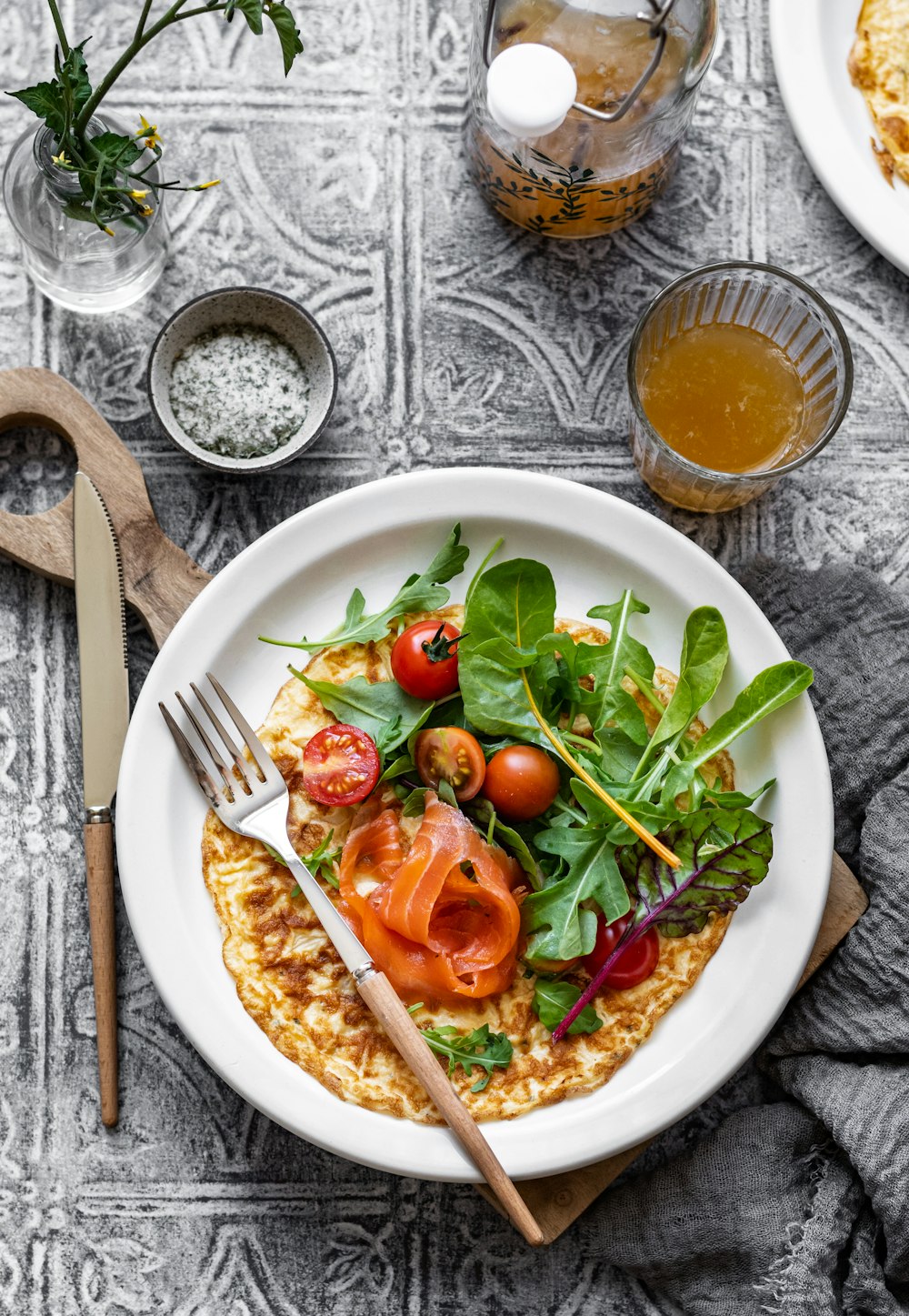 a plate of salad with a fork