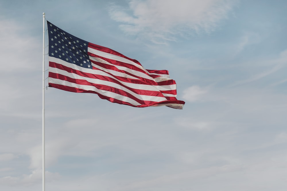 a flag flying on a cloudy day