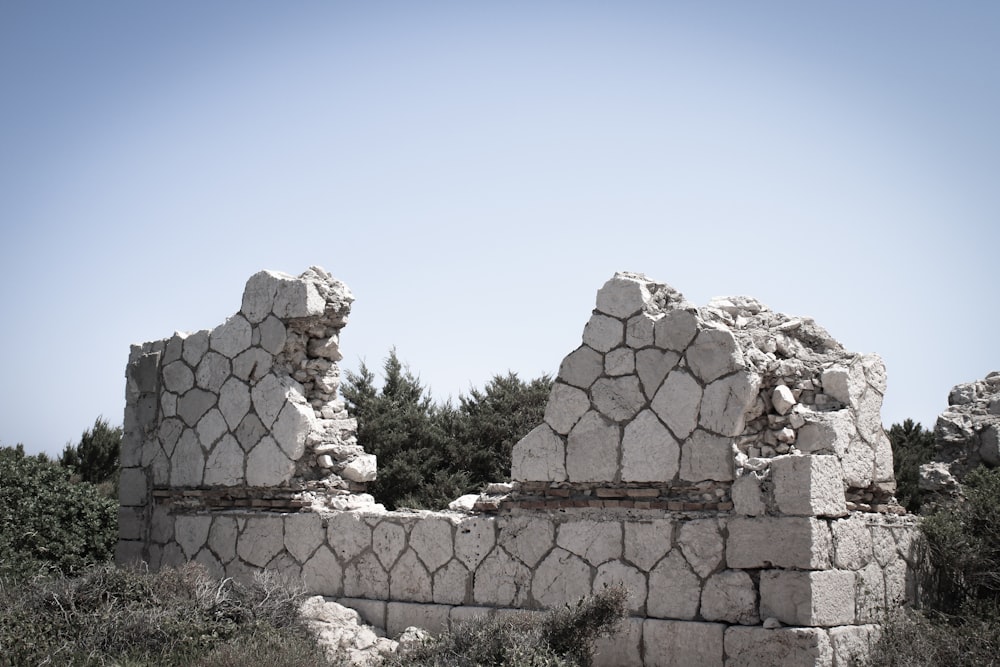 a stone wall with a stone structure