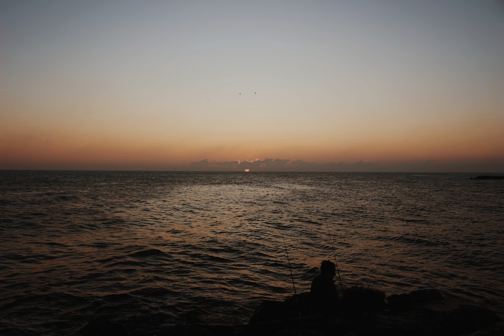 a person fishing in the water