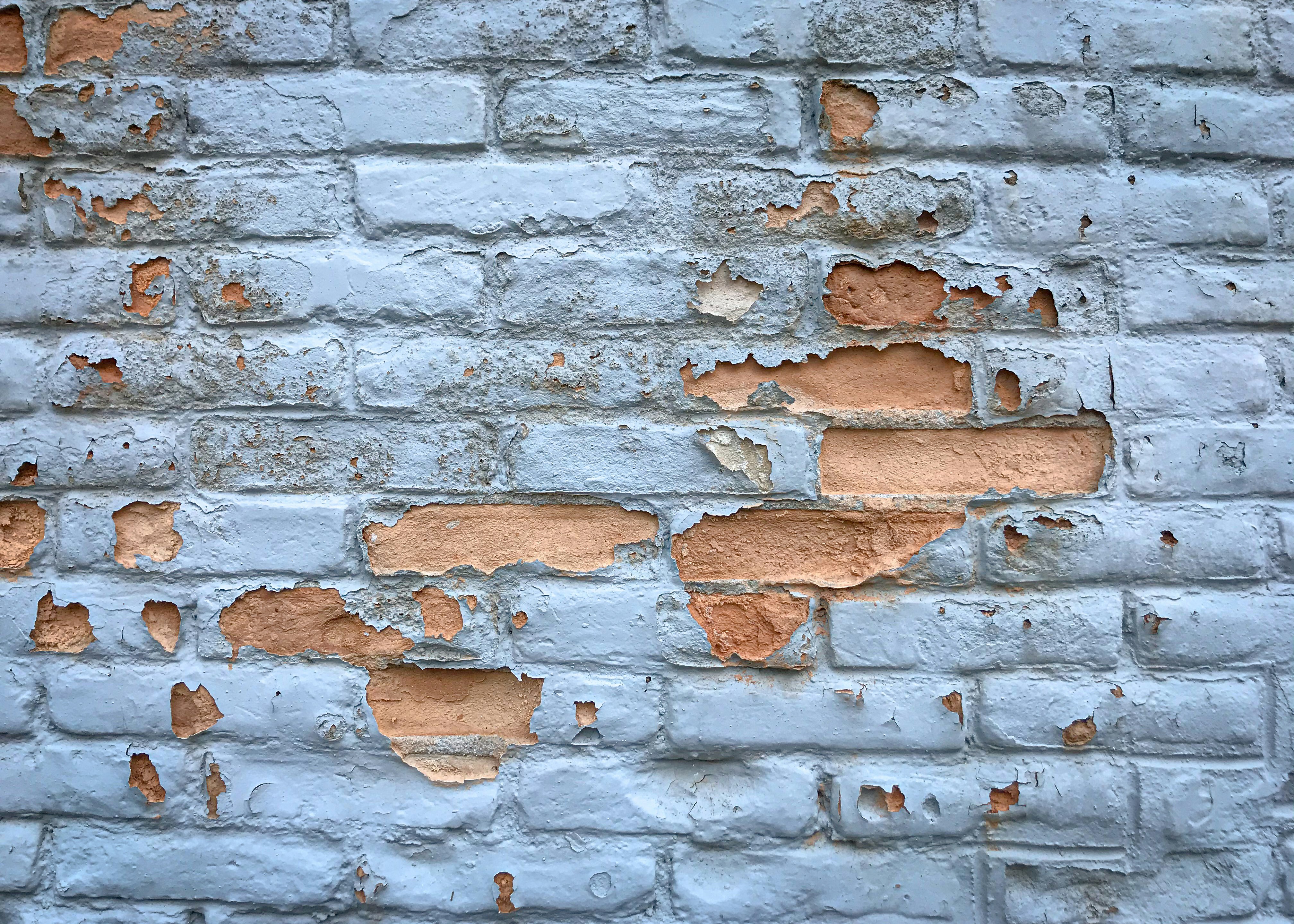 a brick wall with a hole in it