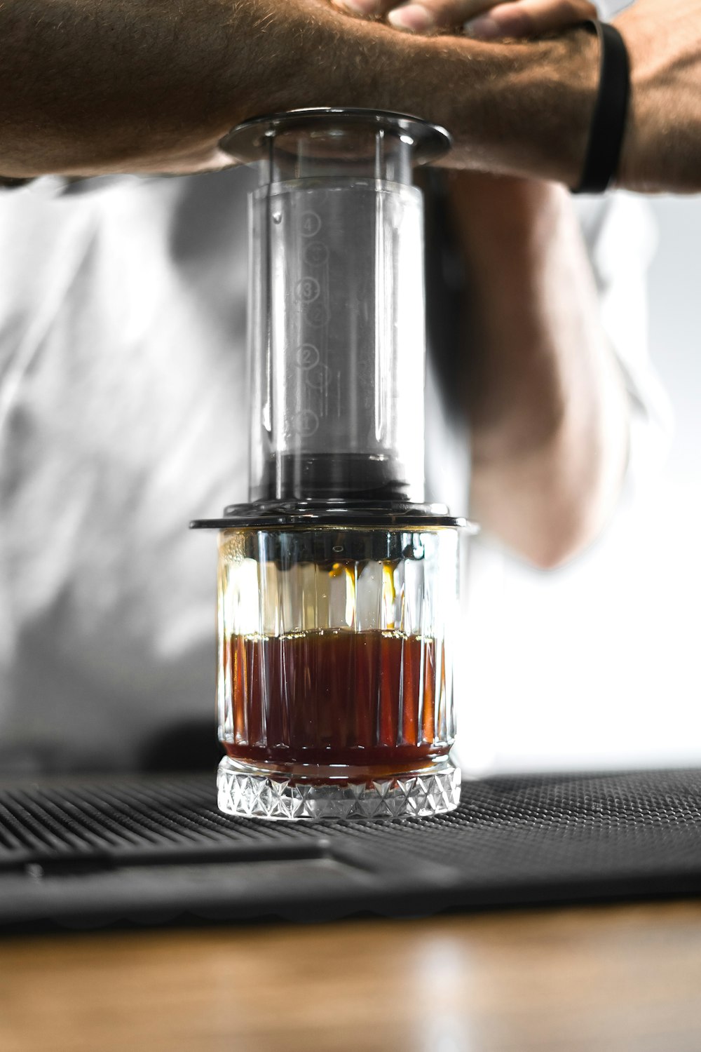 a glass jar with a brown liquid