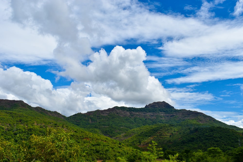 a landscape with hills and clouds