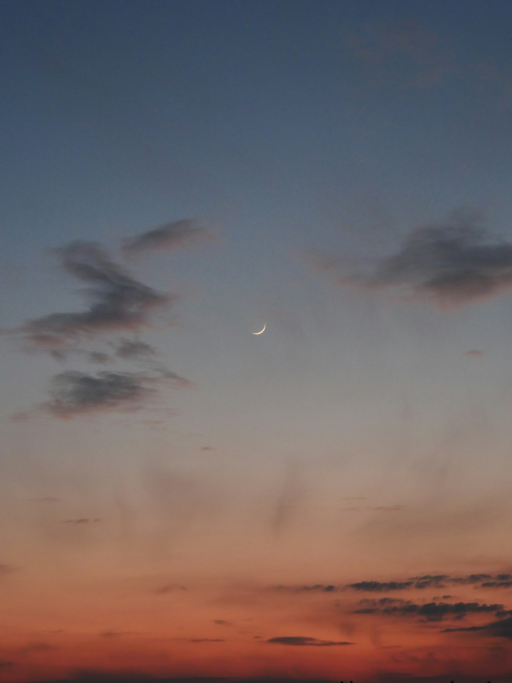 a pink and blue sky with clouds