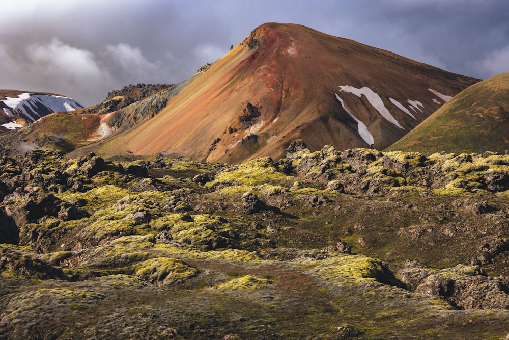 a rocky mountain with snow