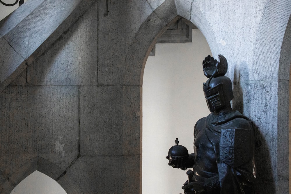 a statue of a person in a helmet and armor