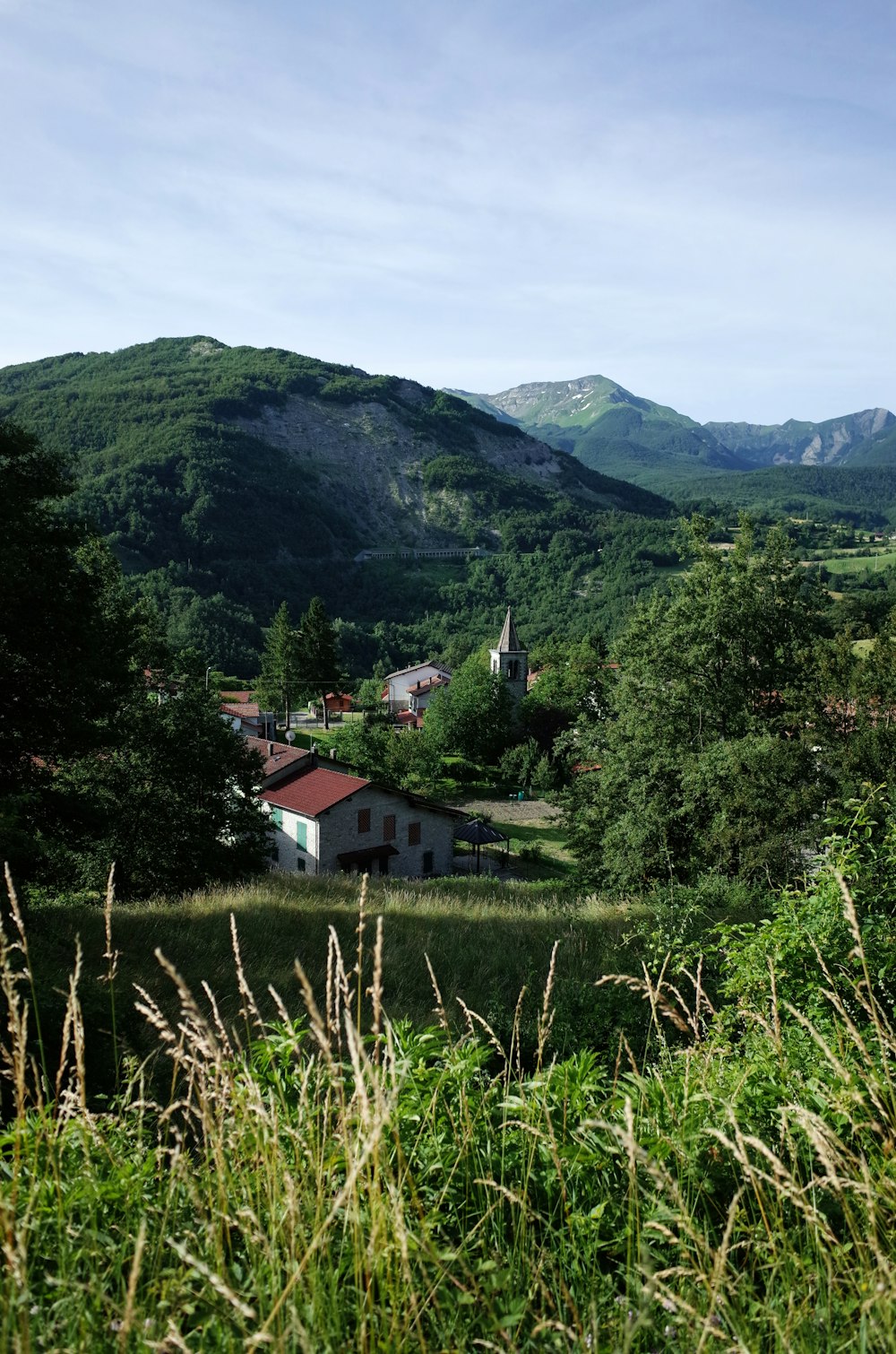 a small white house in a valley