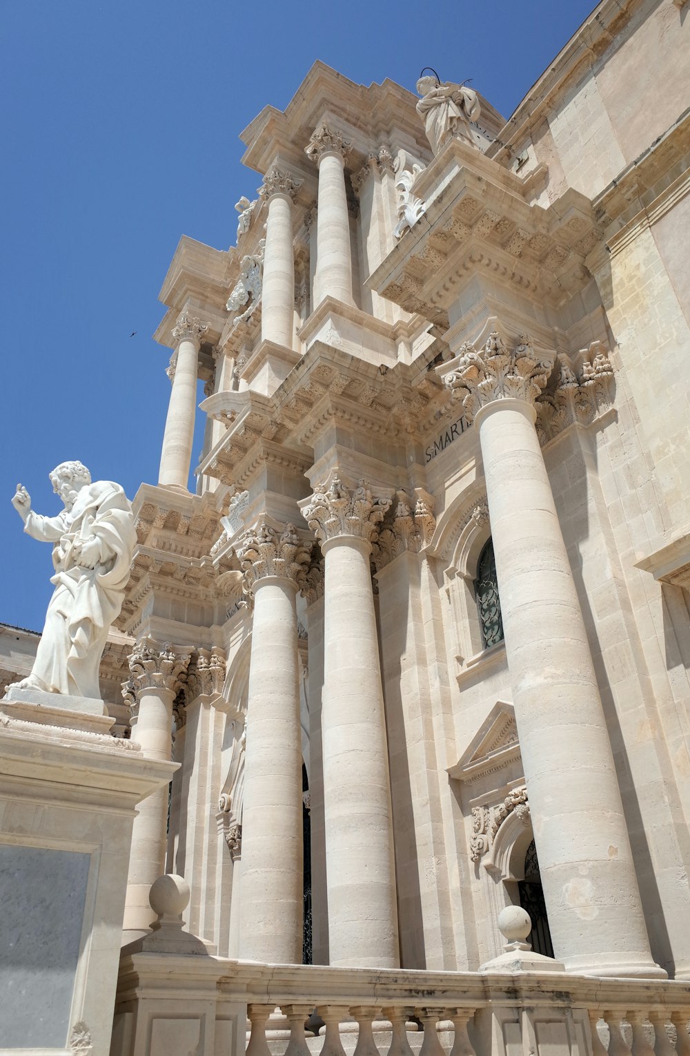 a building with a statue in front