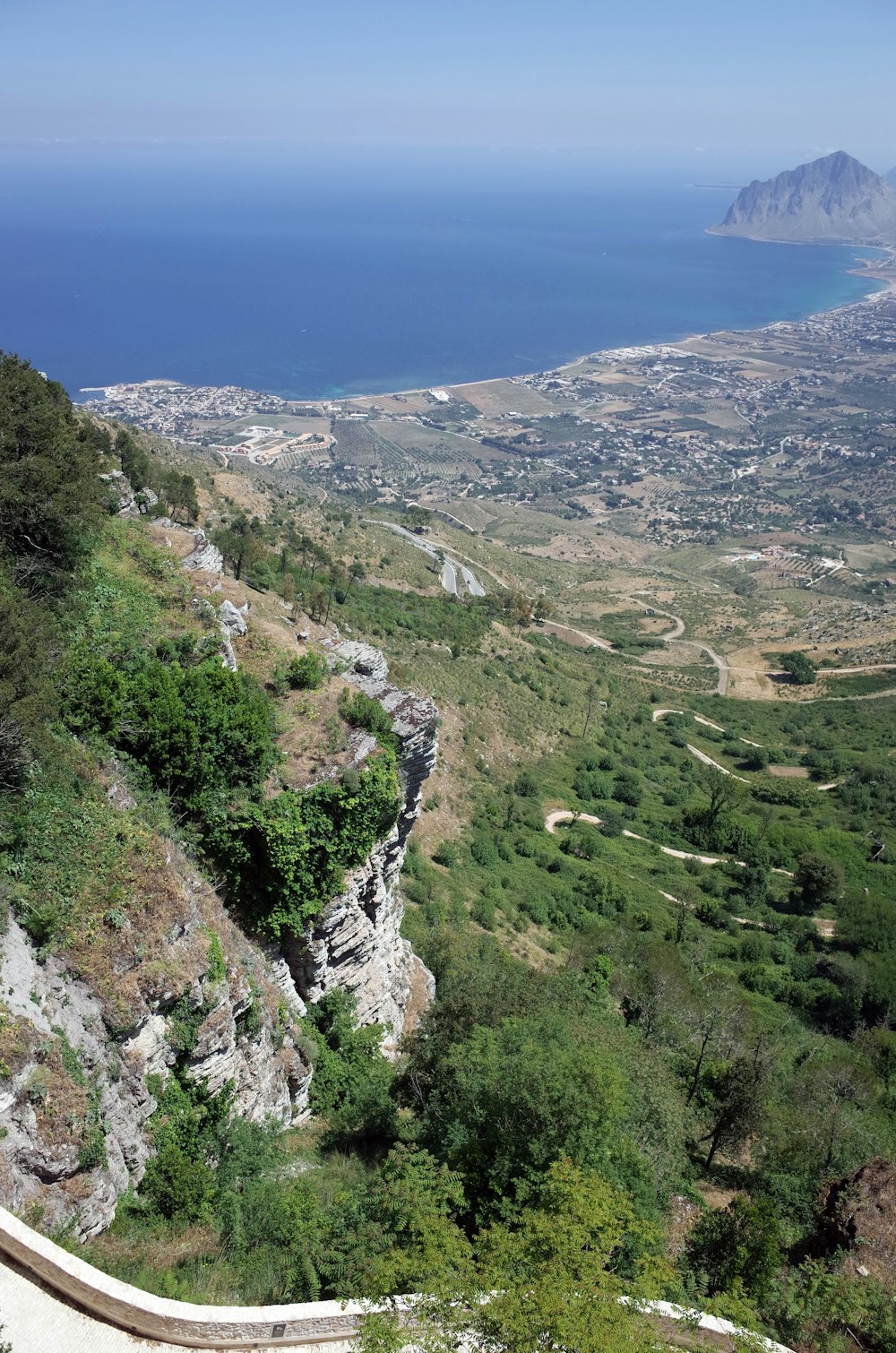 a landscape with a body of water in the back