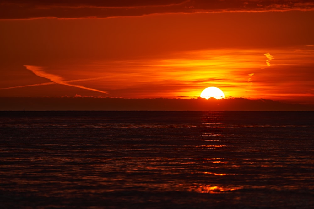 a sunset over a body of water