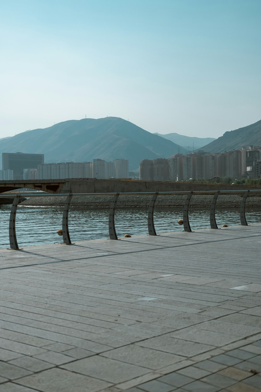 a body of water with buildings in the background