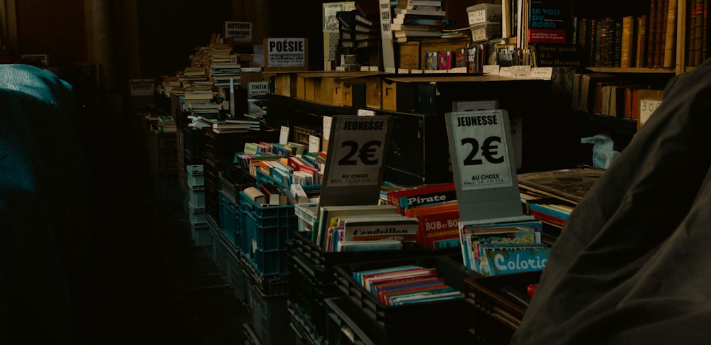 a person standing in a room with shelves of books