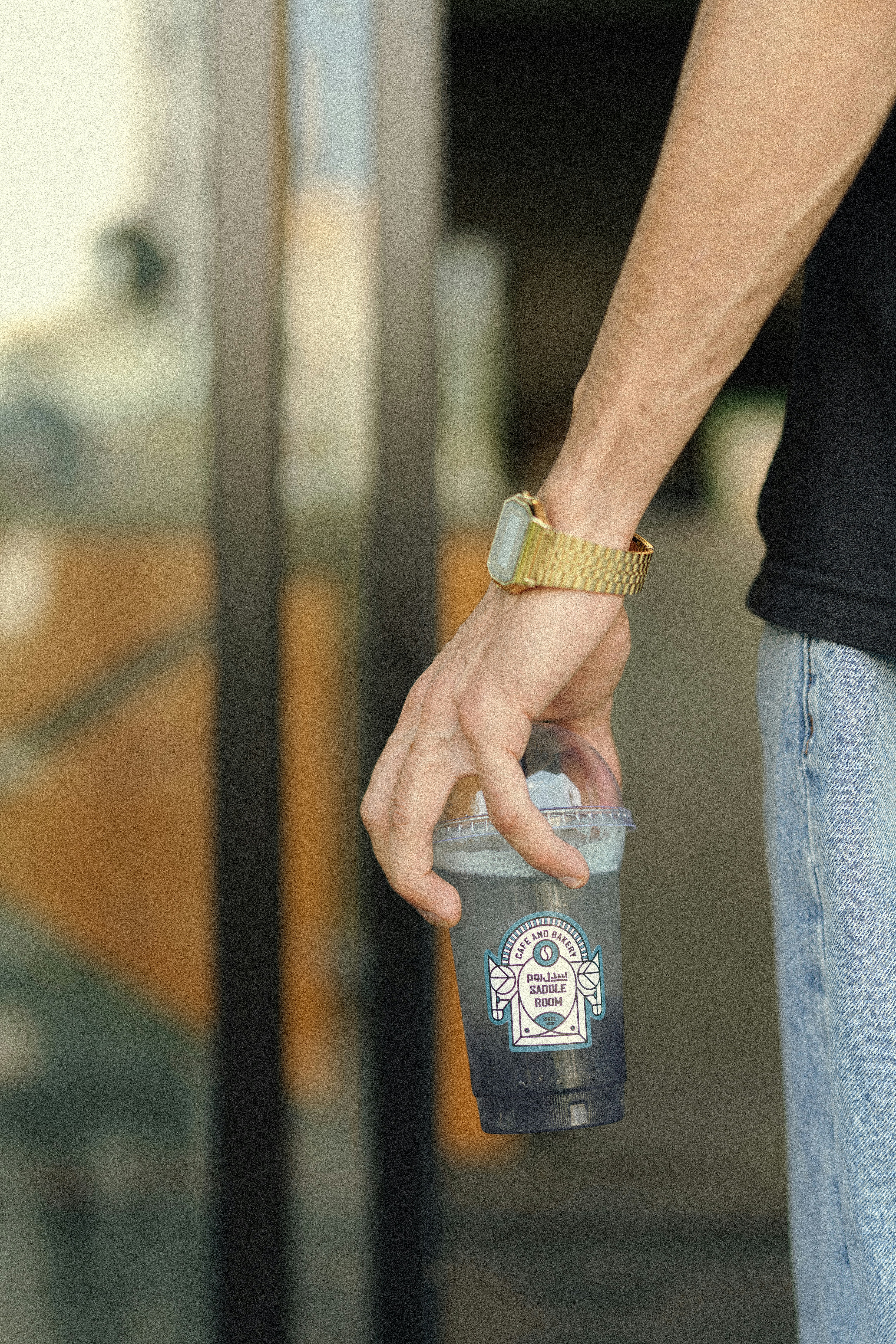 a hand holding a can