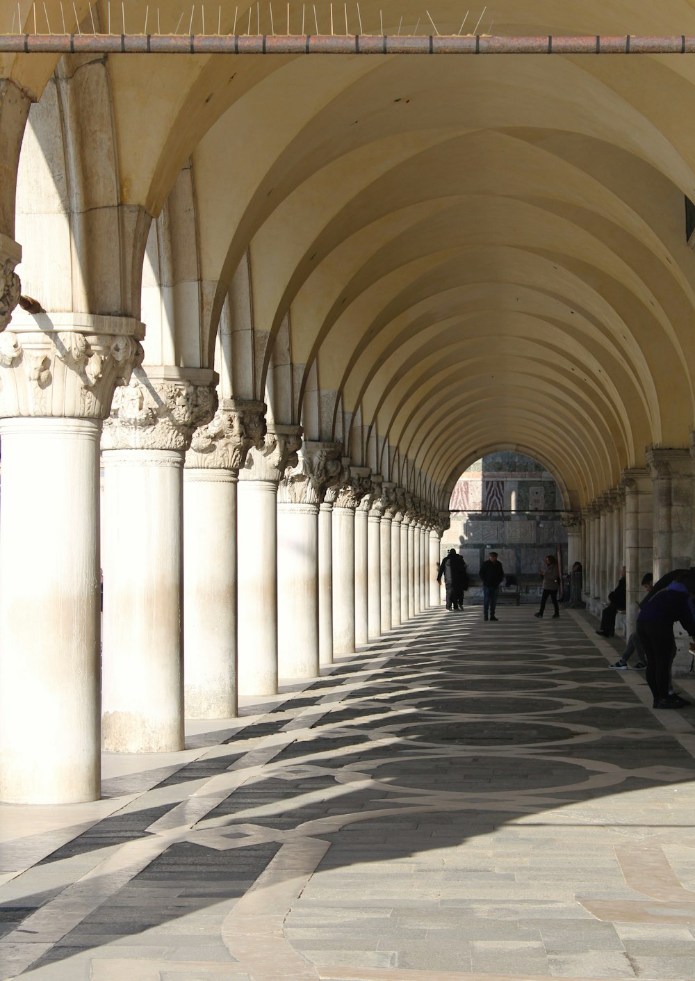 a group of people walking in a large building