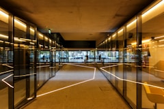 a long hallway with glass walls