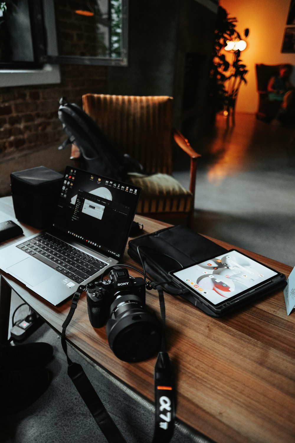 a laptop and camera on a table