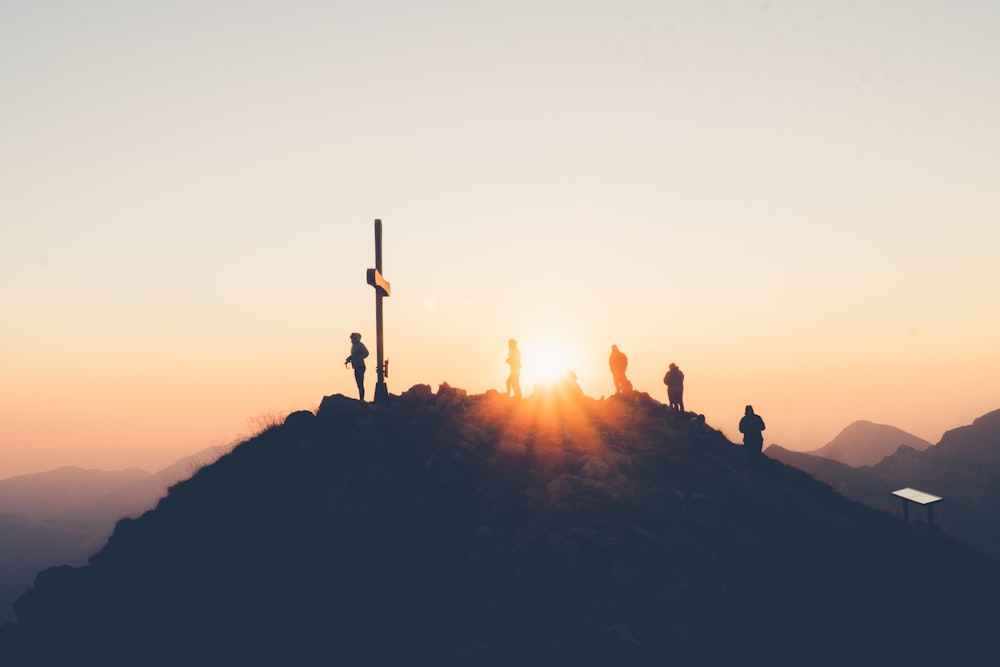 a group of people standing on a mountain top