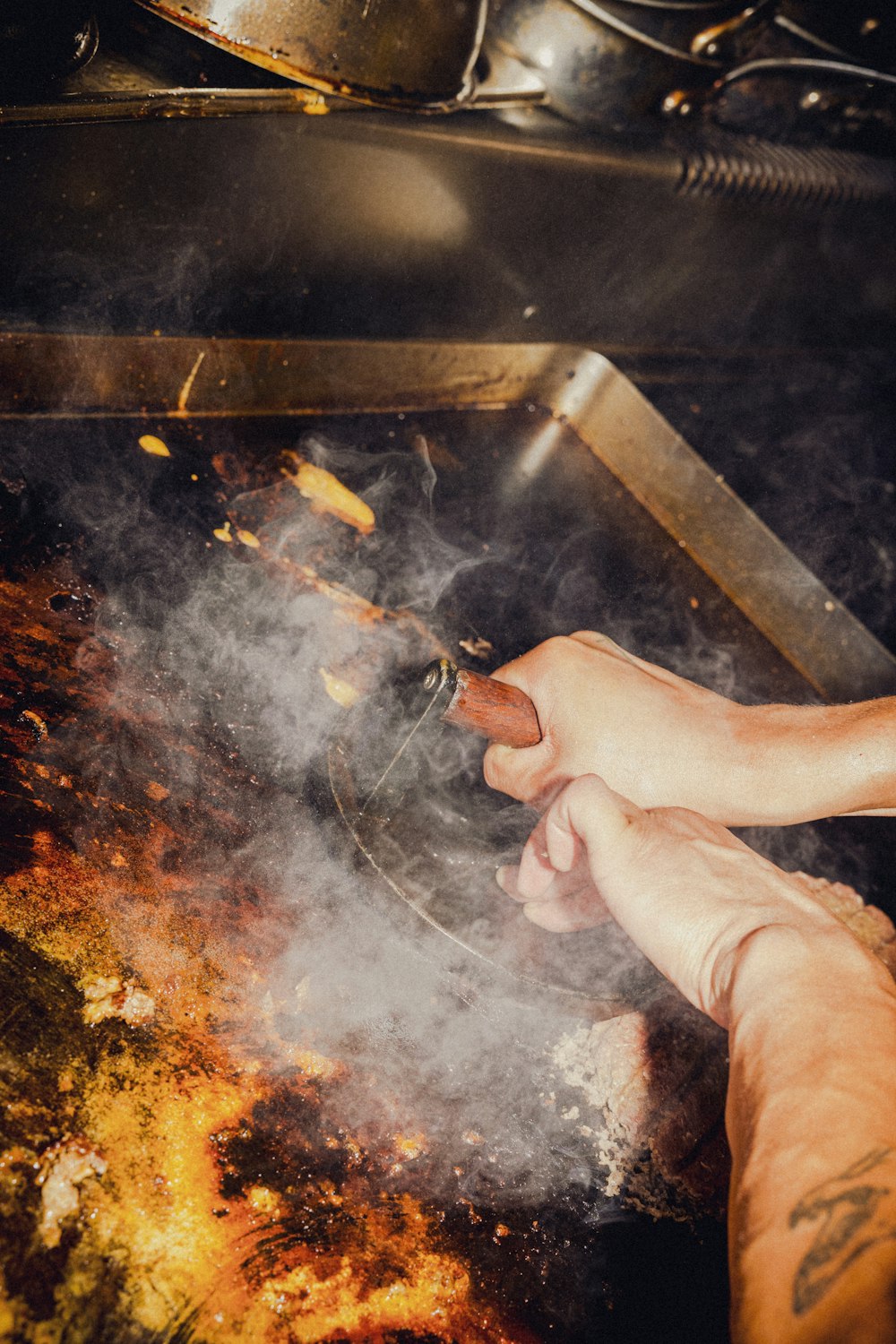 a person cooking food in a pan