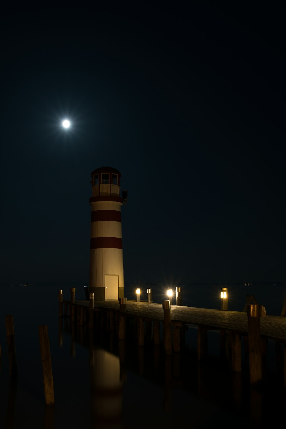 a lighthouse on a pier