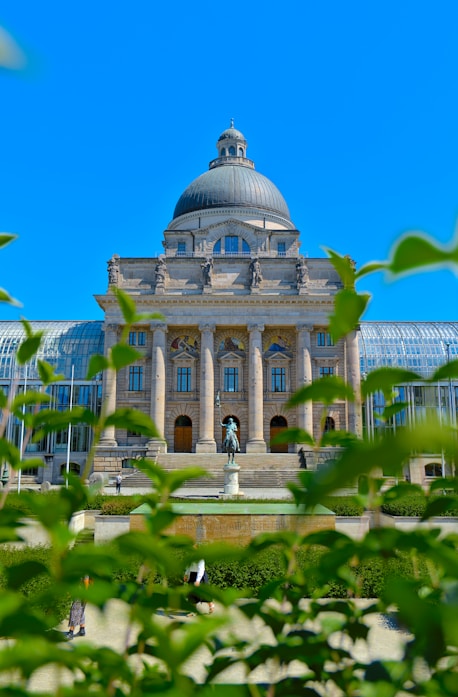 a large building with a dome and columns