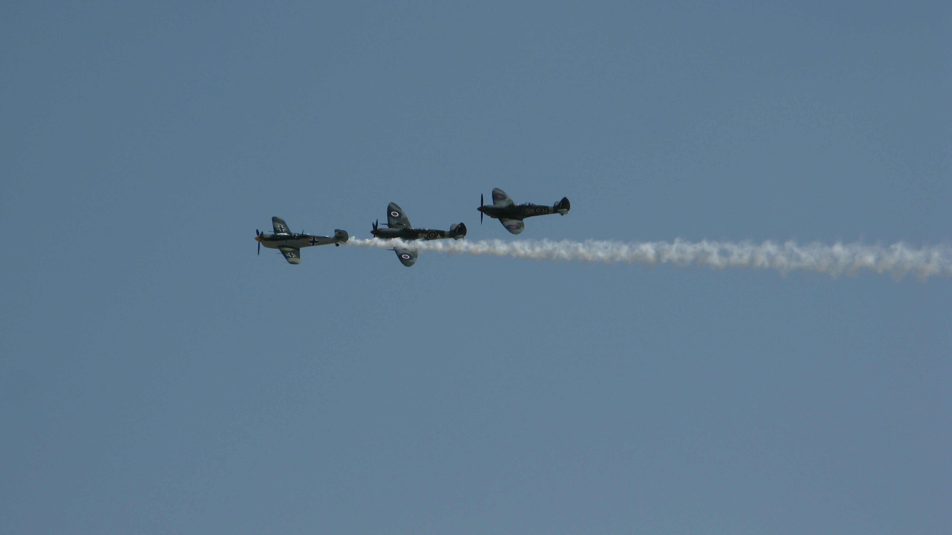 a group of airplanes flying in the sky