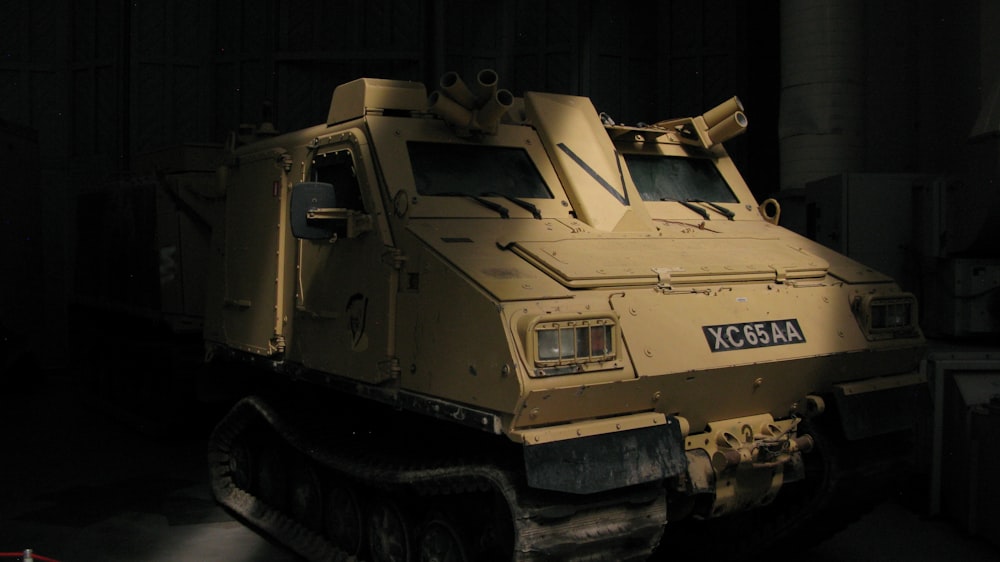 a military vehicle in a dark room