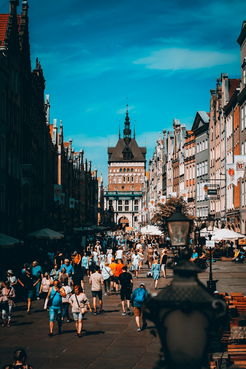 a crowd of people walking in a city