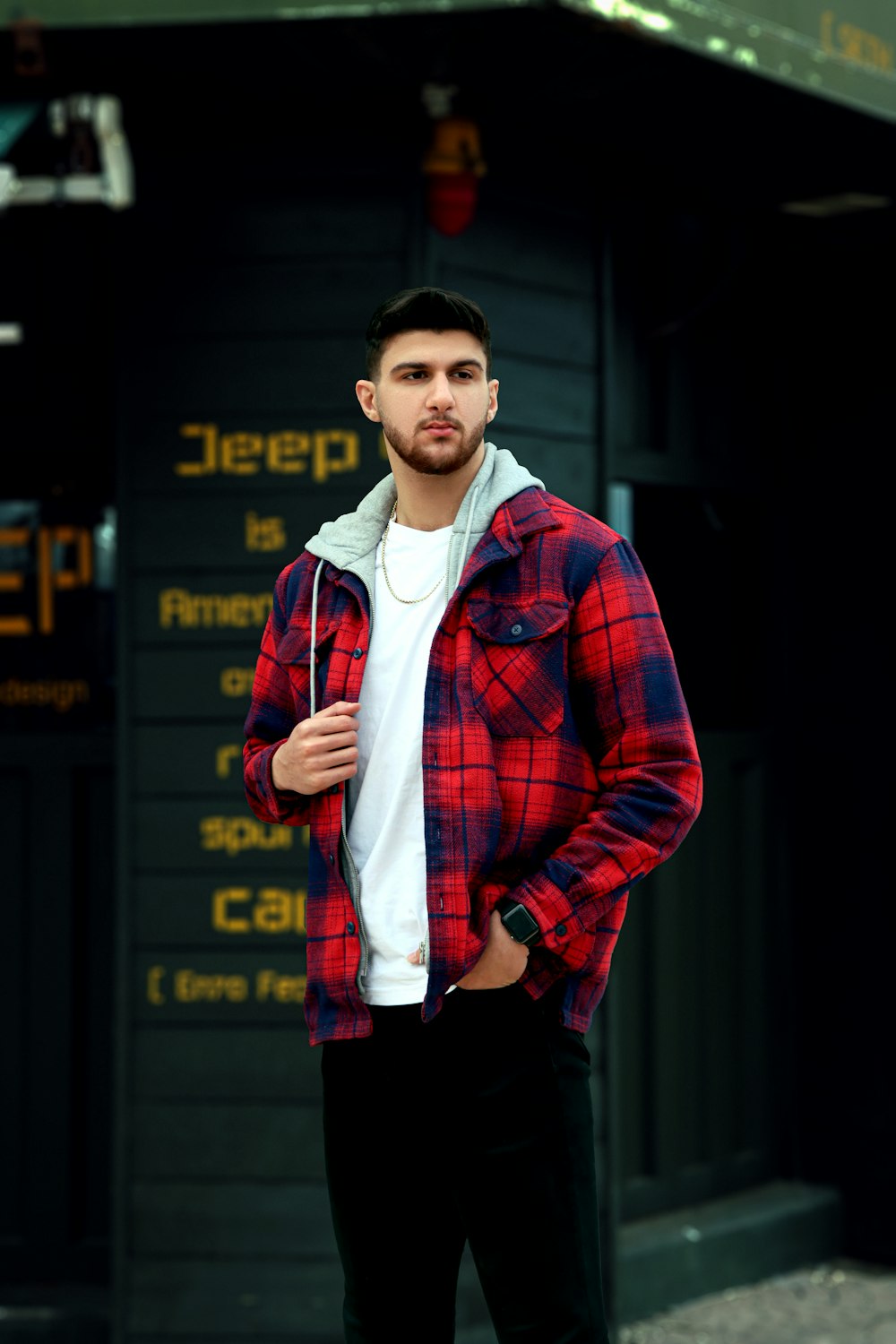 a man standing in front of a sign