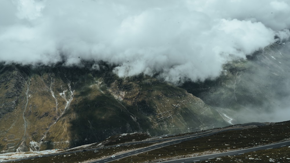 a mountain with clouds