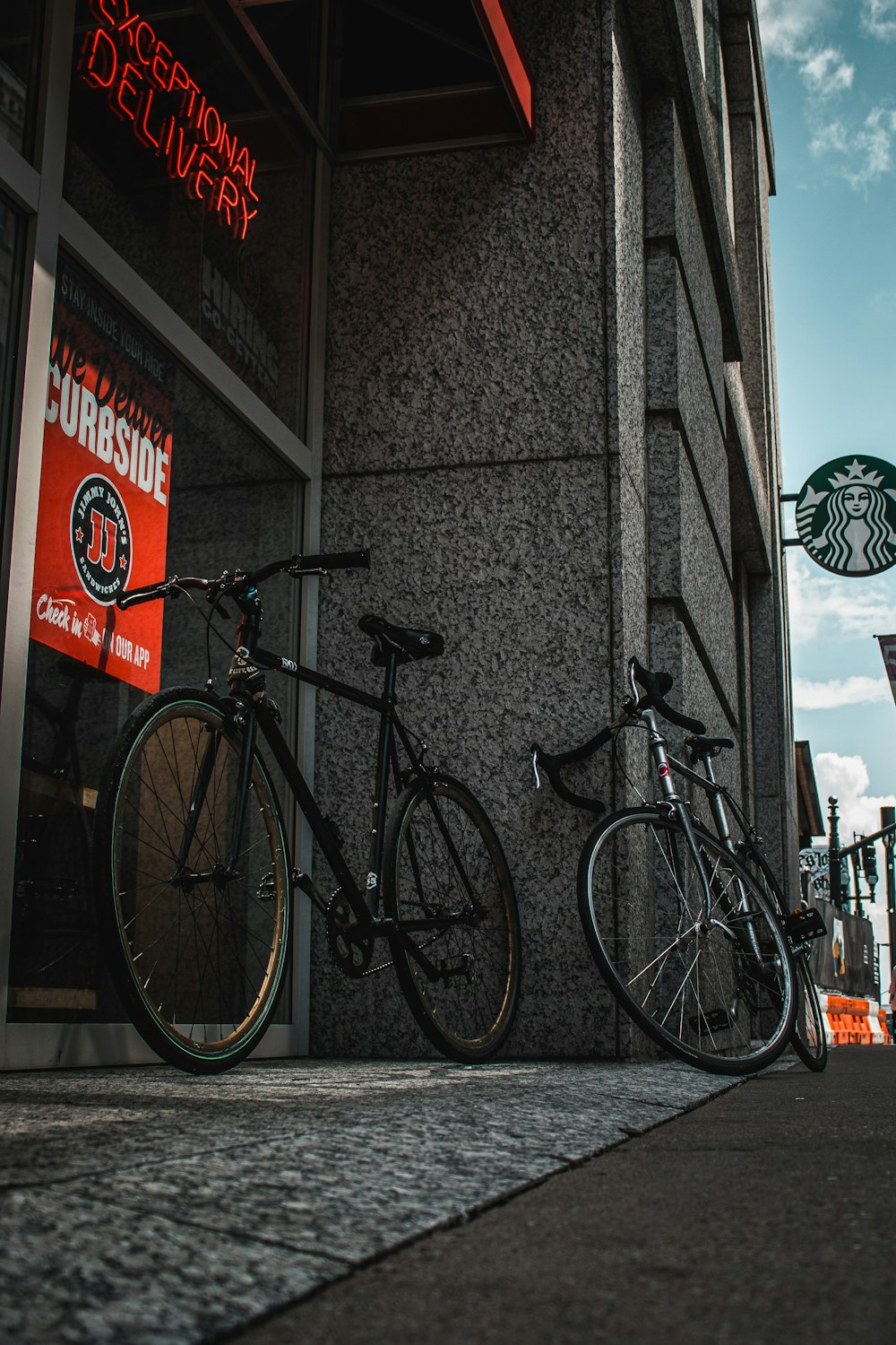 a group of bikes parked outside a building