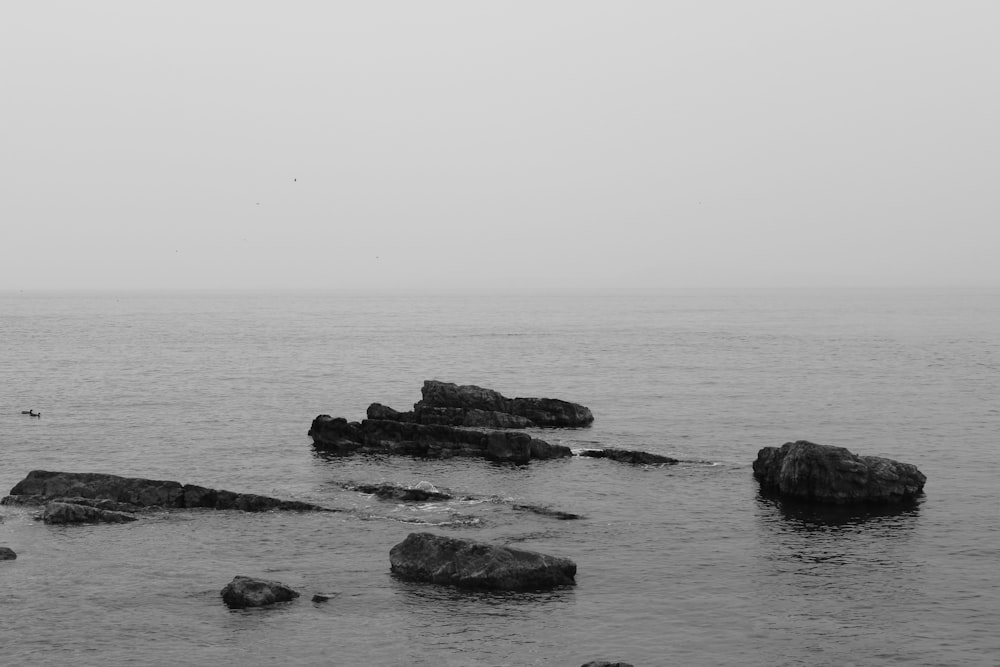 a group of rocks in the water