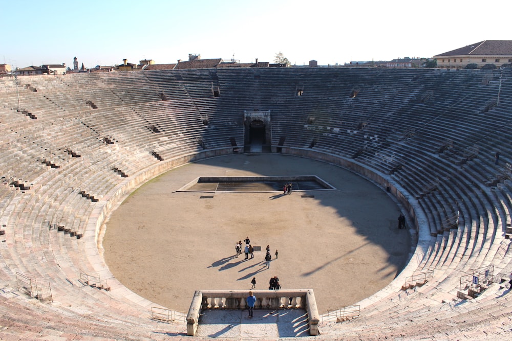 a large circular structure with people around it