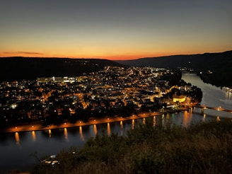 Sunset view over Naperville’s scenic riverwalk with twinkling lights.
