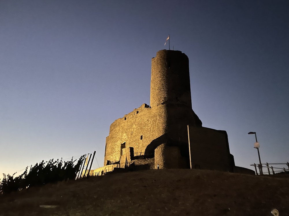 a stone castle on a hill