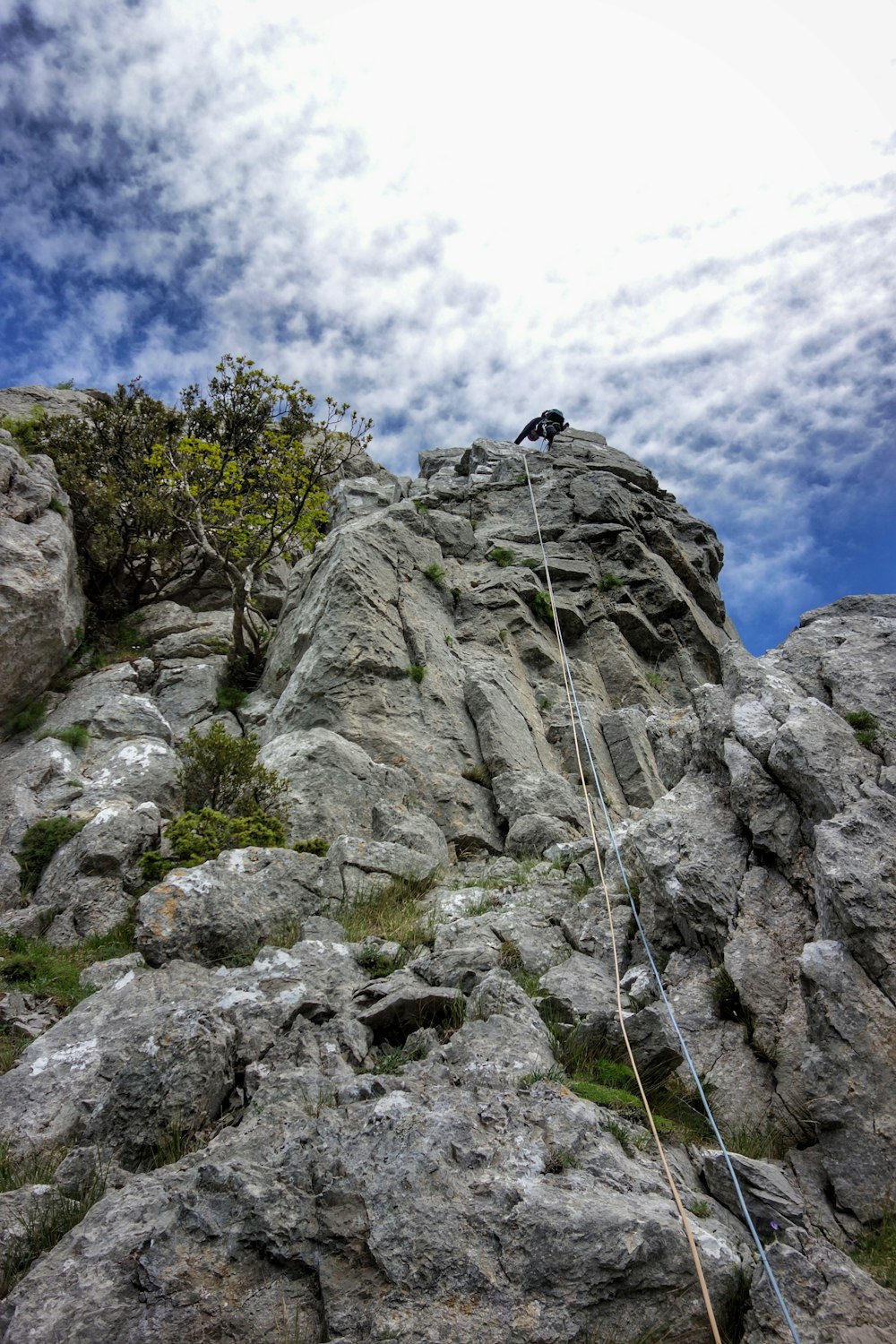 a person climbing a rocky mountain