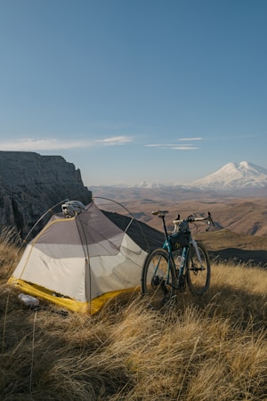 Glowing campfire at a hammock bikepacking camp providing warmth and ambiance under the night sky