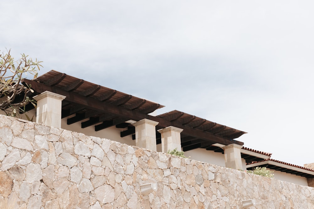 a building with a stone wall