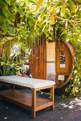 a wooden bench in front of a shed
