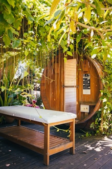 a wooden bench in front of a shed