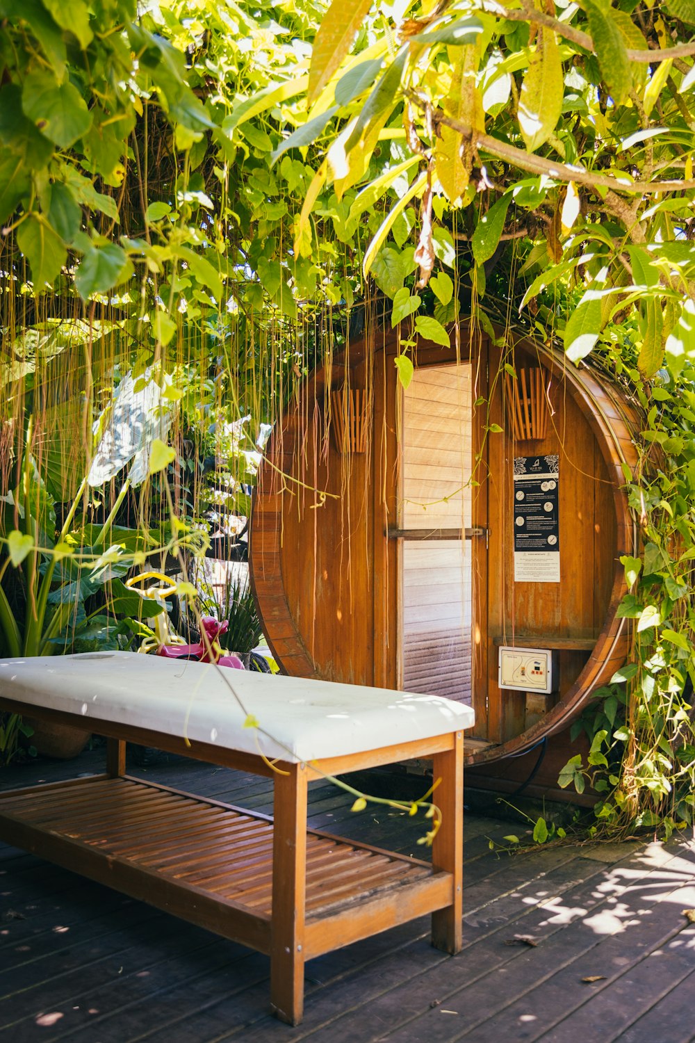 a wooden bench in front of a shed