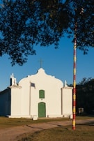 a white building with a cross on top