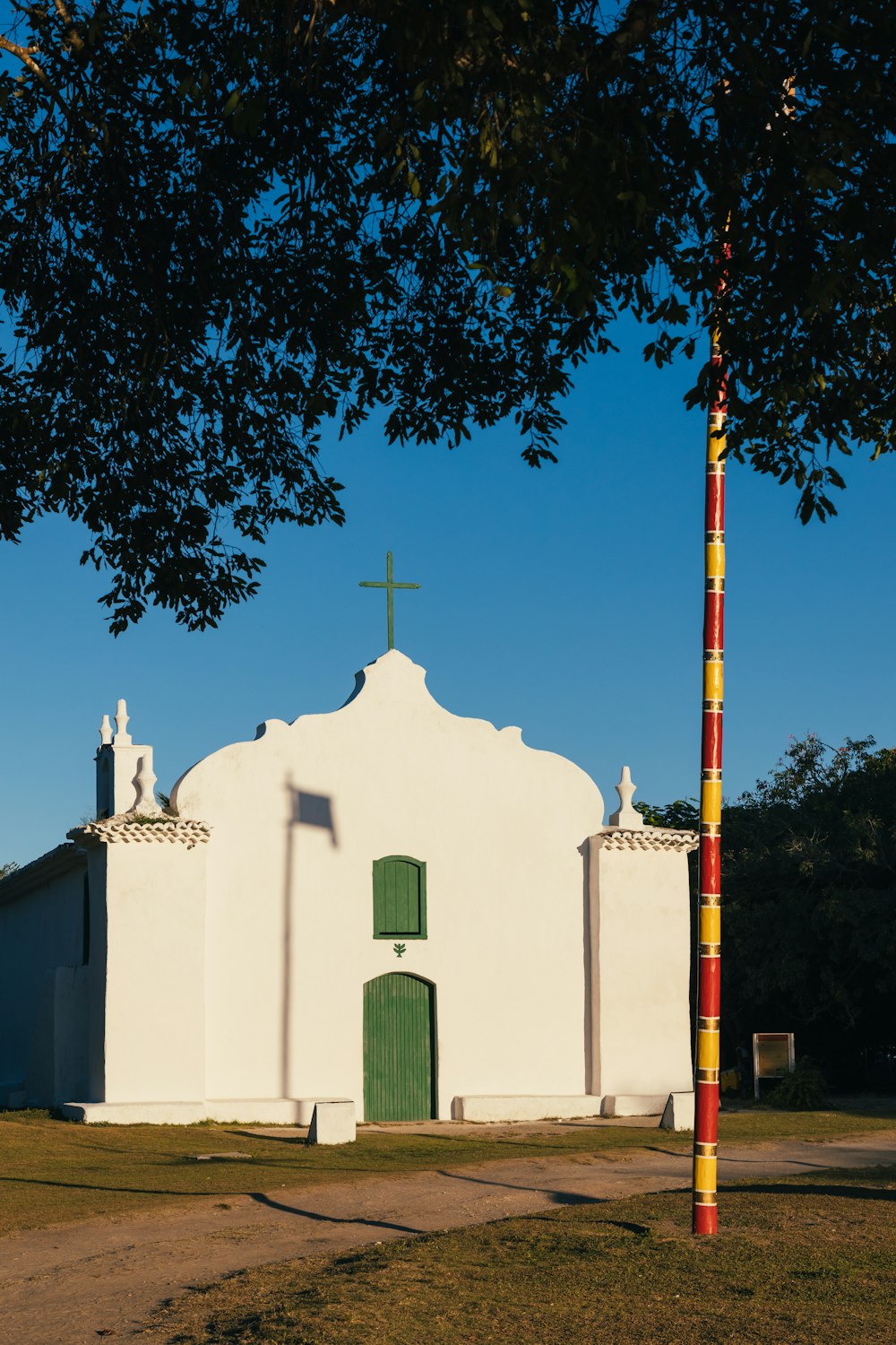 a white building with a cross on top